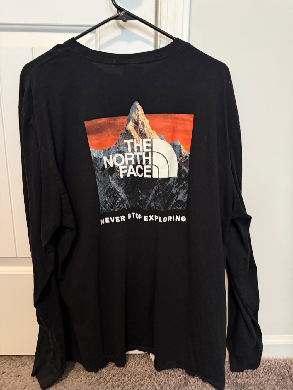 The North Face Black Long-Sleeve Tee with Orange Sunset Mountain Graphic